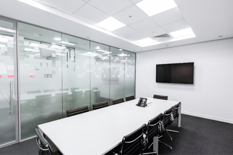 Office interior with a glass partition. Stock Image. New Image Interiors LTD