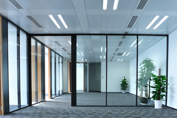 Glass office partition with black framing. Stock Image. New Image Interiors LTD